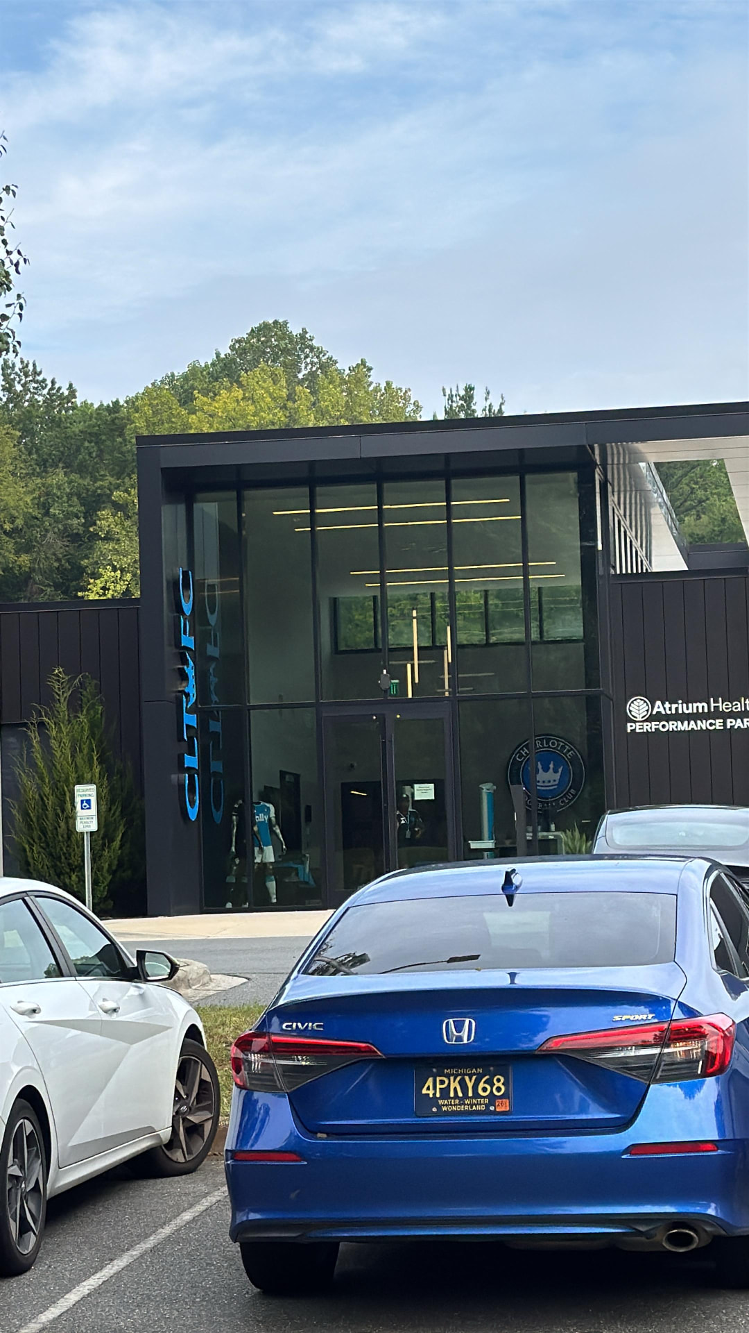 The Charlotte FC training facility entrance at Atrium Health Performance Park, where the supporters buses gathered before departure