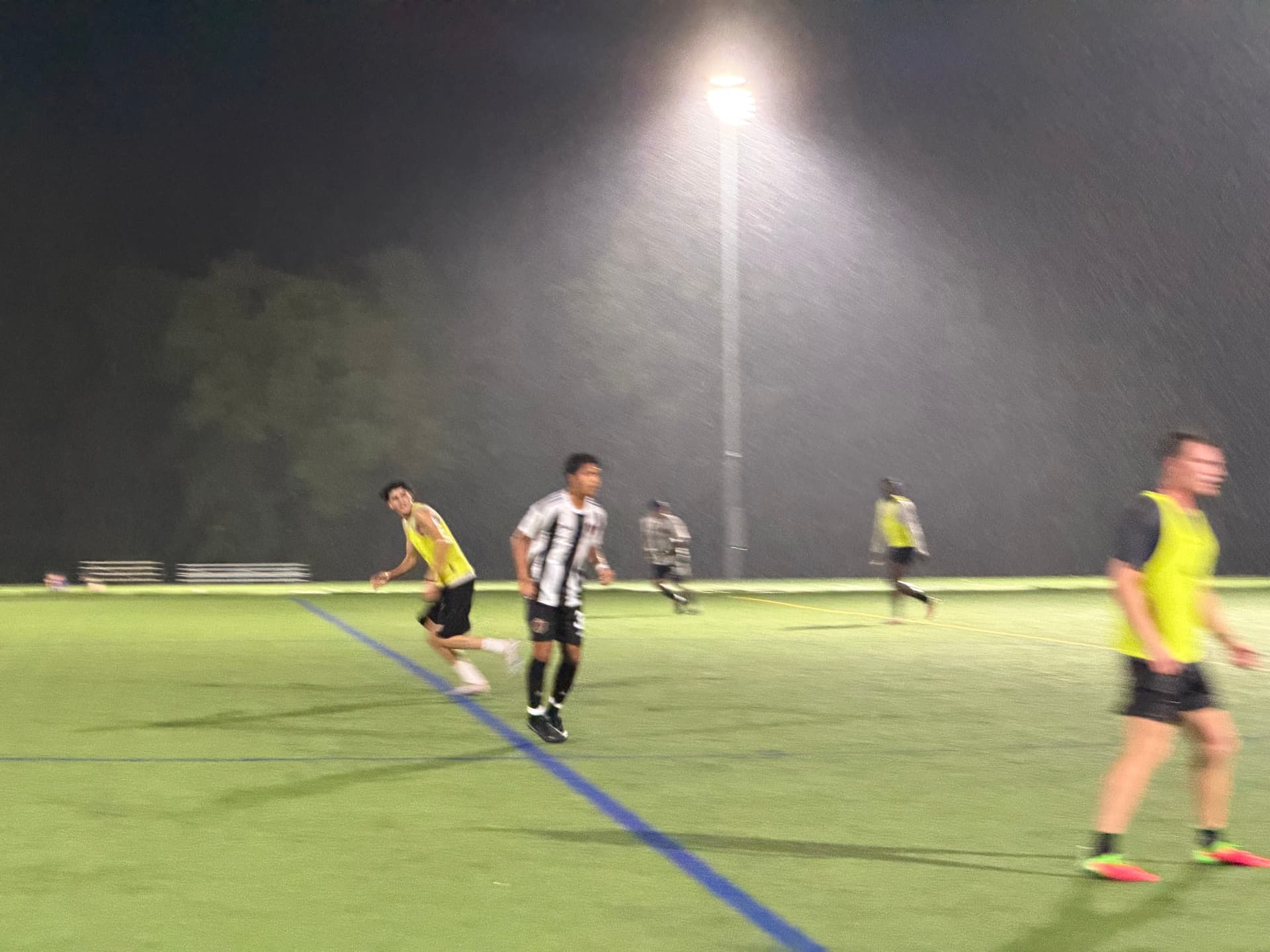 NC United FC players competing in the rain under the floodlights during the second half against PFM FC