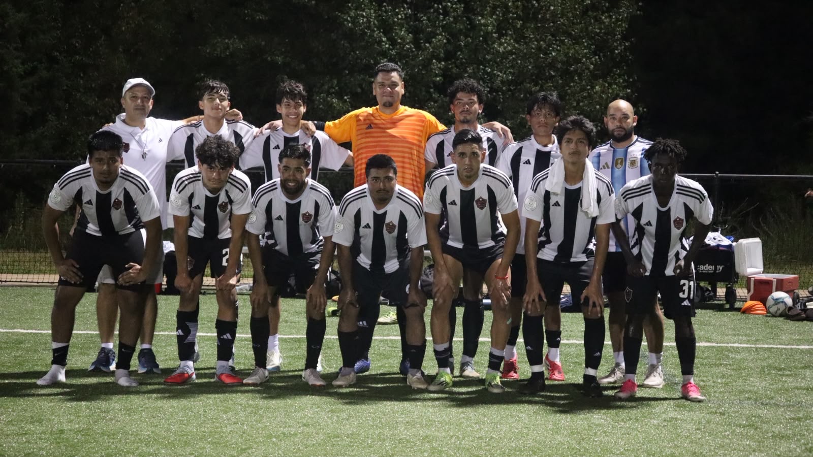 The NC United FC squad and staff lined up together on the field after the September 4 friendly