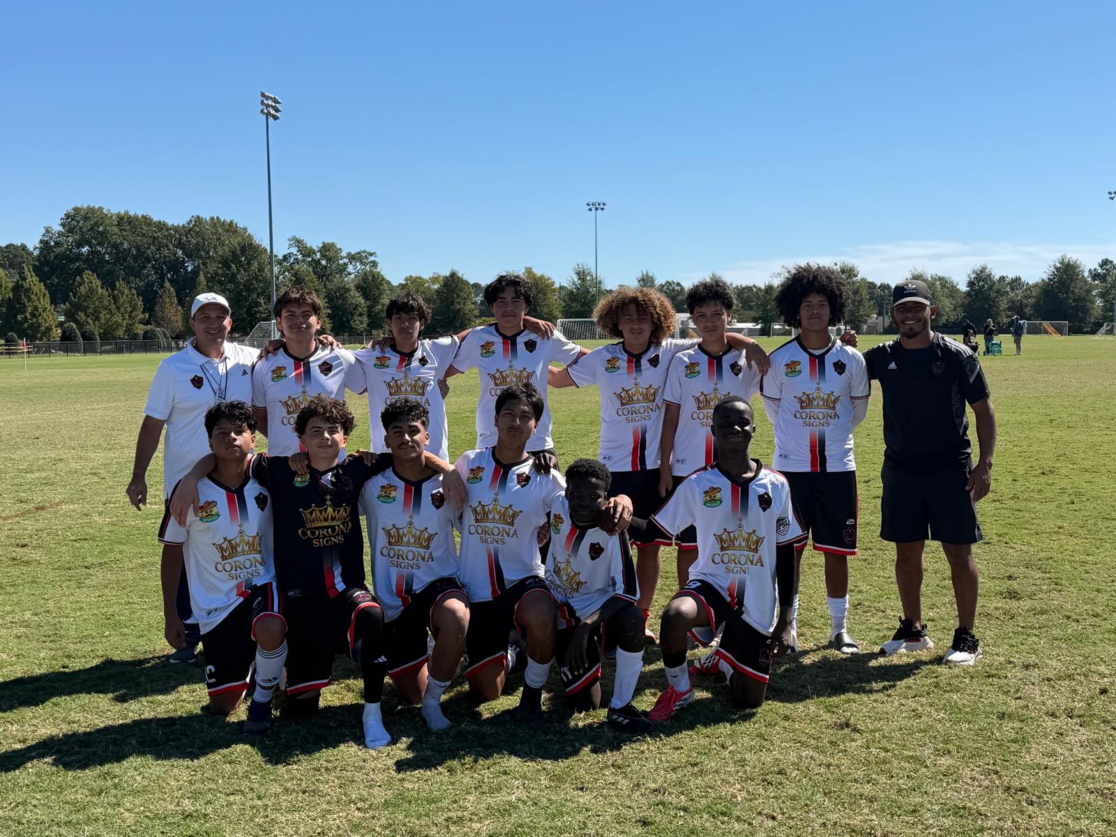 NC United FC U17 Academy players and coaches together on the field.