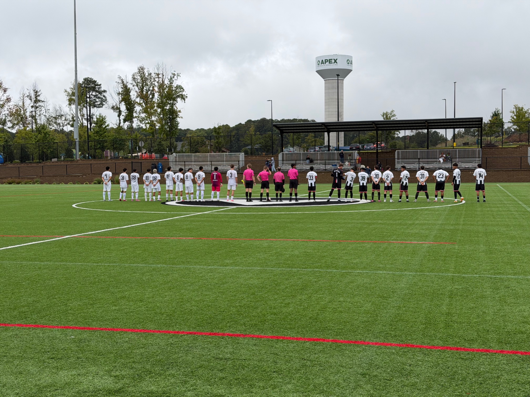 NC United FC Men D1 and Briar United Castle FC lined up at midfield before their October 3 match at Pleasant Park — Stadium Field 1 in Raleigh, North Carolina.