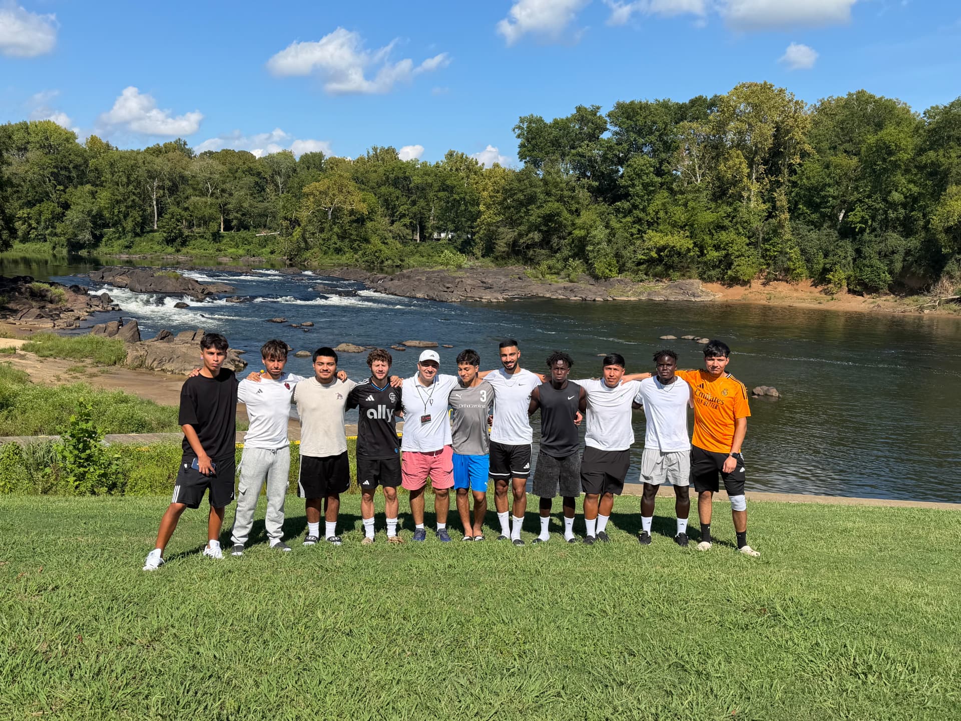 NC United FC players and staff together beside the Roanoke River after traveling from the Charlotte area to Weldon.