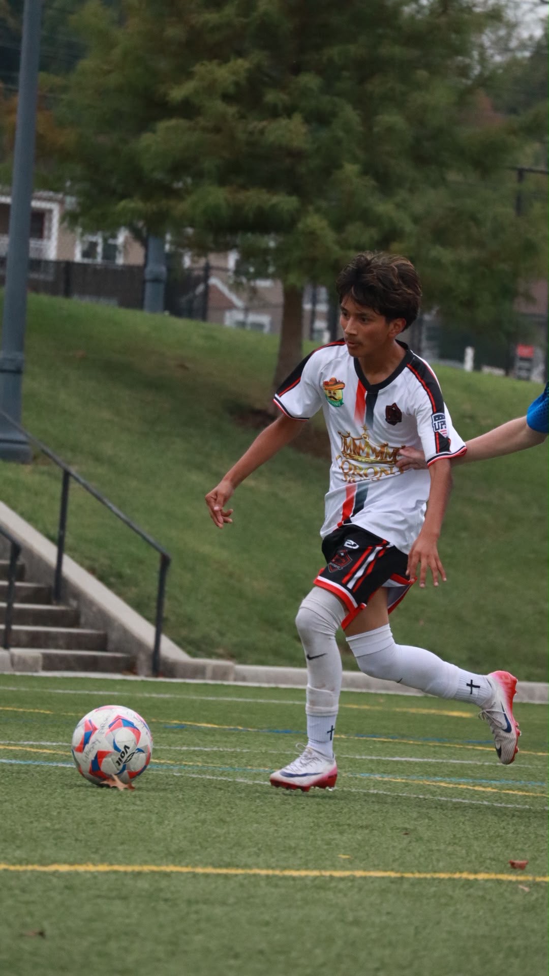 NC United FC U17 Academy player advancing the ball against Rush United in Radford, Virginia.